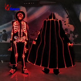 A glowing skeleton costume with a cape